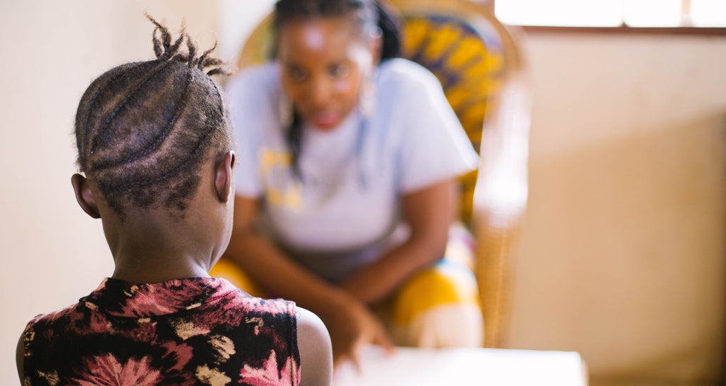 Child looking at World Hope staff