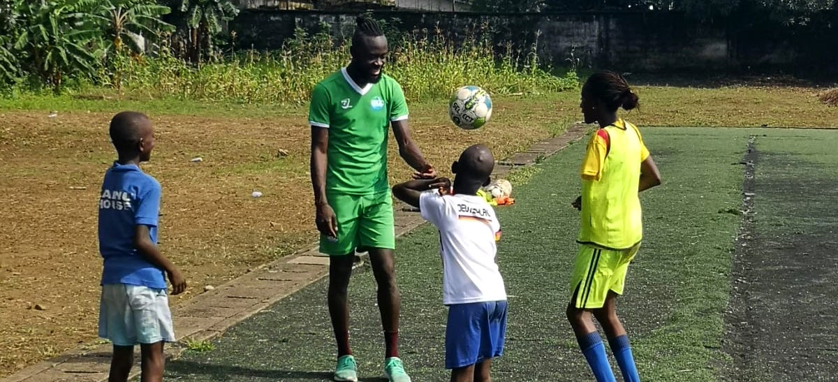 The Sierra Leonean National Soccer Team with ETC children, staff, and families