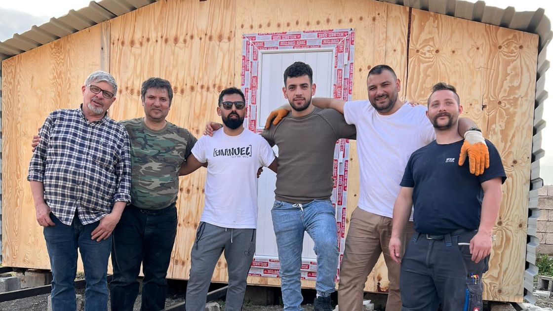 builders in front of shelter in Turkiye