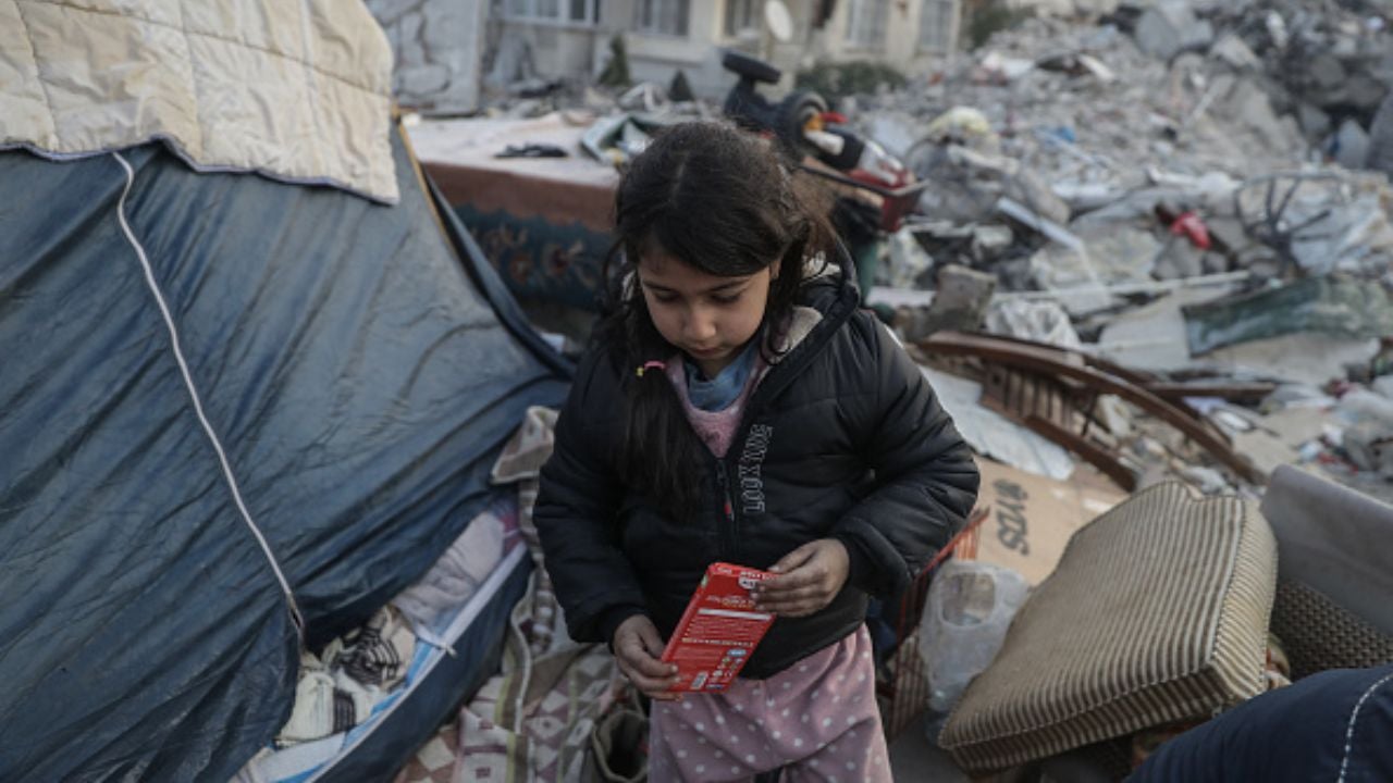 little girl in the middle of rubble