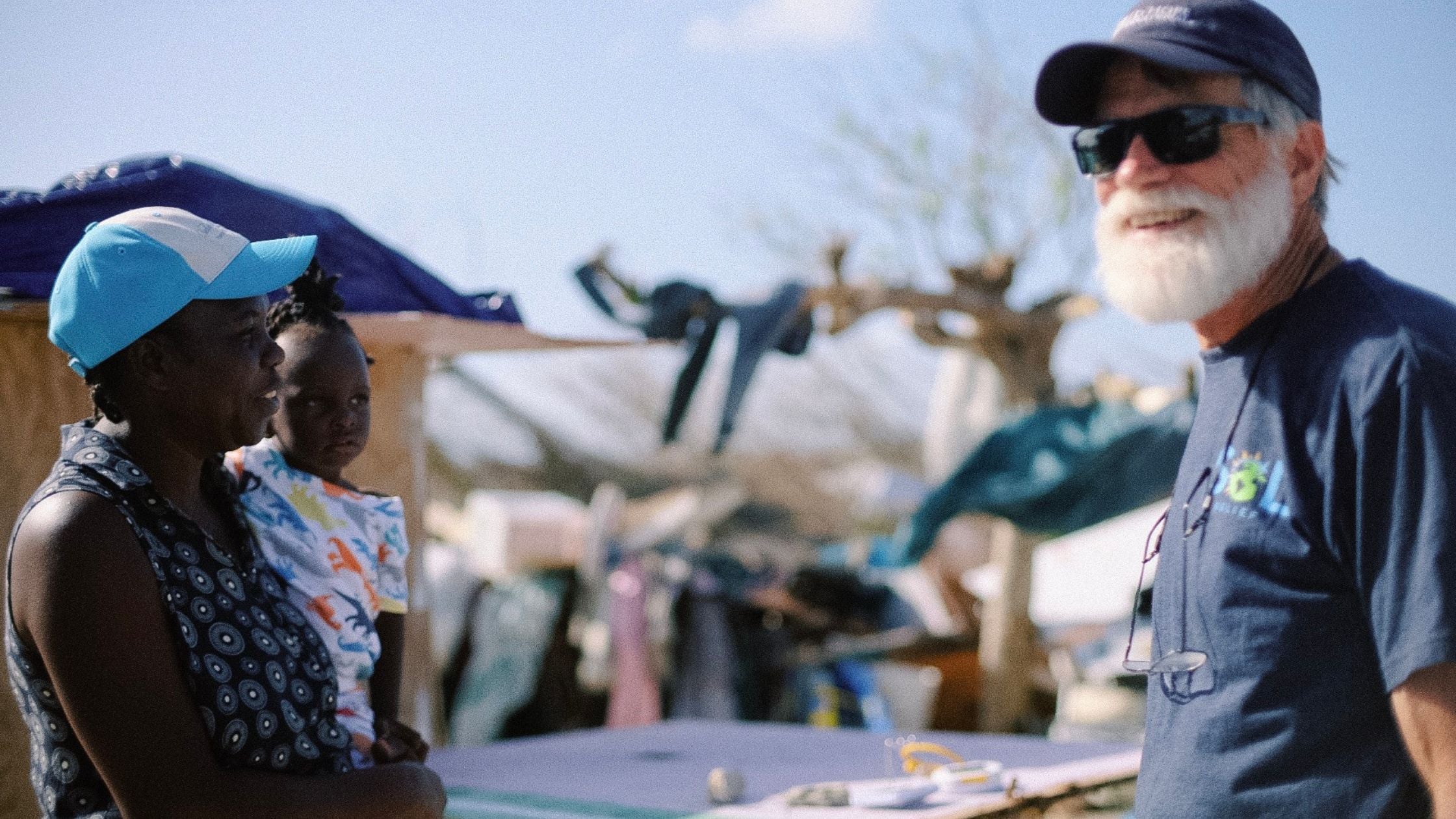 Volunteer talking with local in the Bahamas after Hurricane Dorian