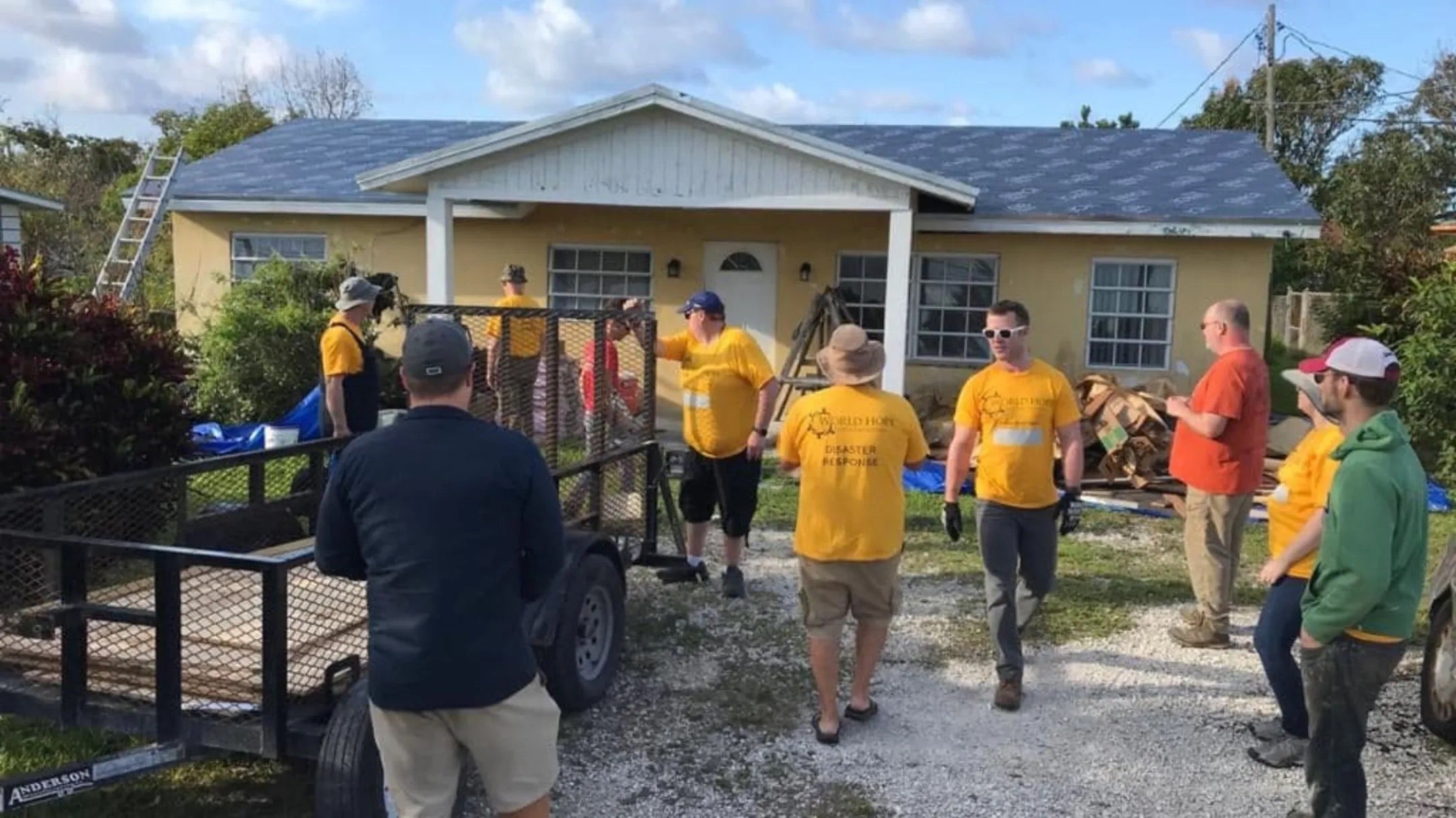 Volunteers in the Bahamas helping rebuild a building