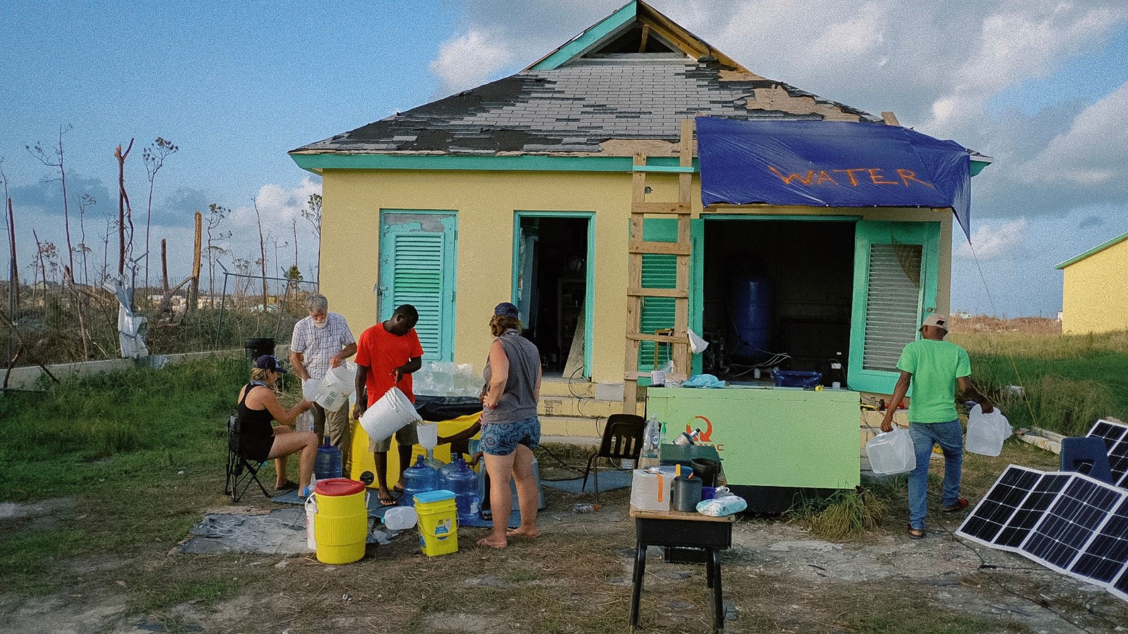 Volunteers making and distributing clean water in the Bahamas after Hurricane Dorian