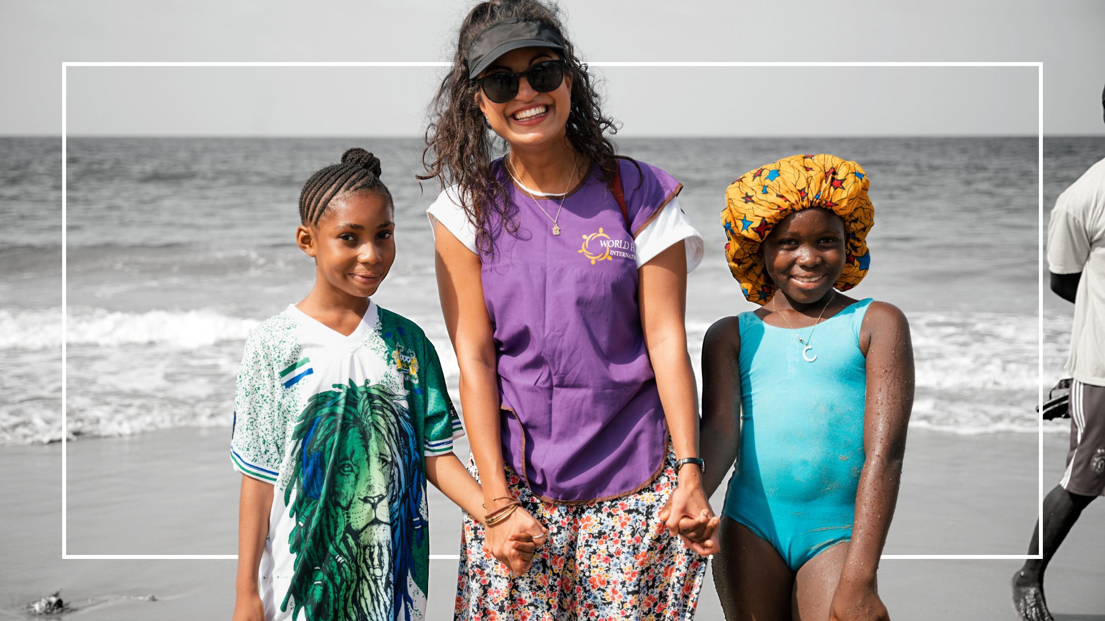 World Hope Worker with kids at the beach