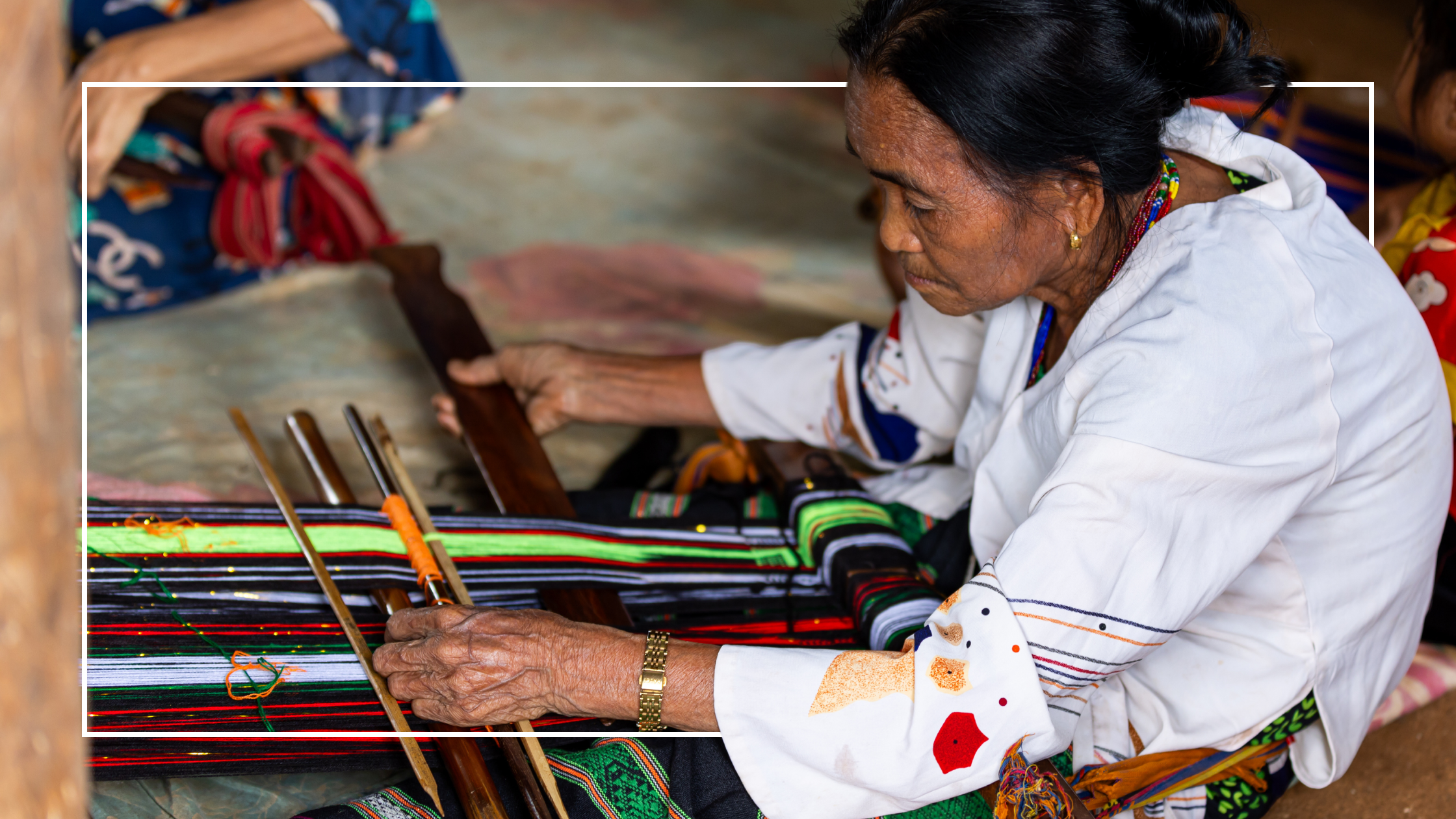 Older woman weaving cultural design