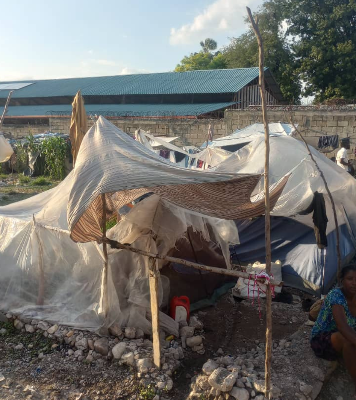 Temporary shelter built with wooden poles and plastic