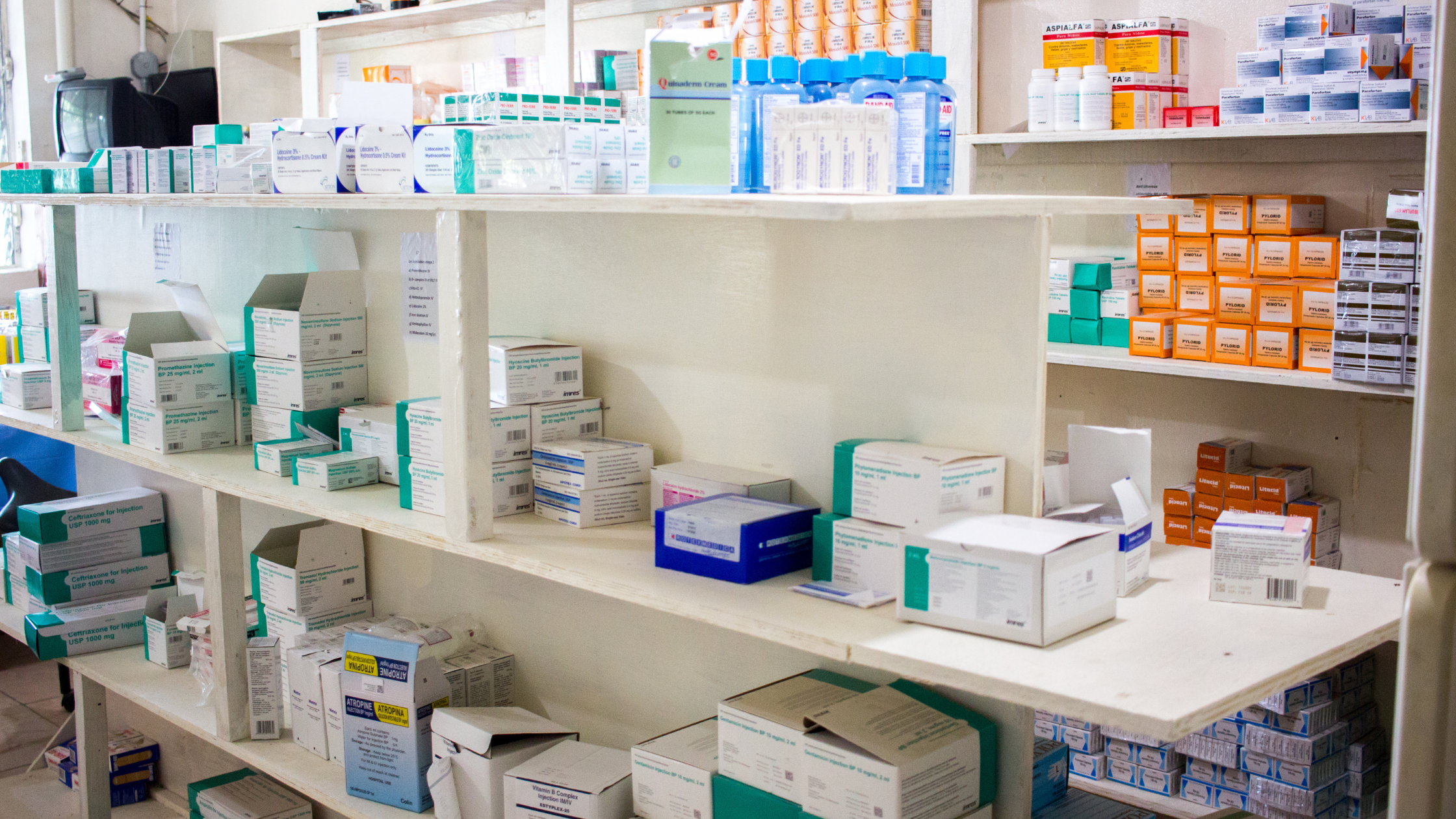 Shelves filled with medications and medical supplies