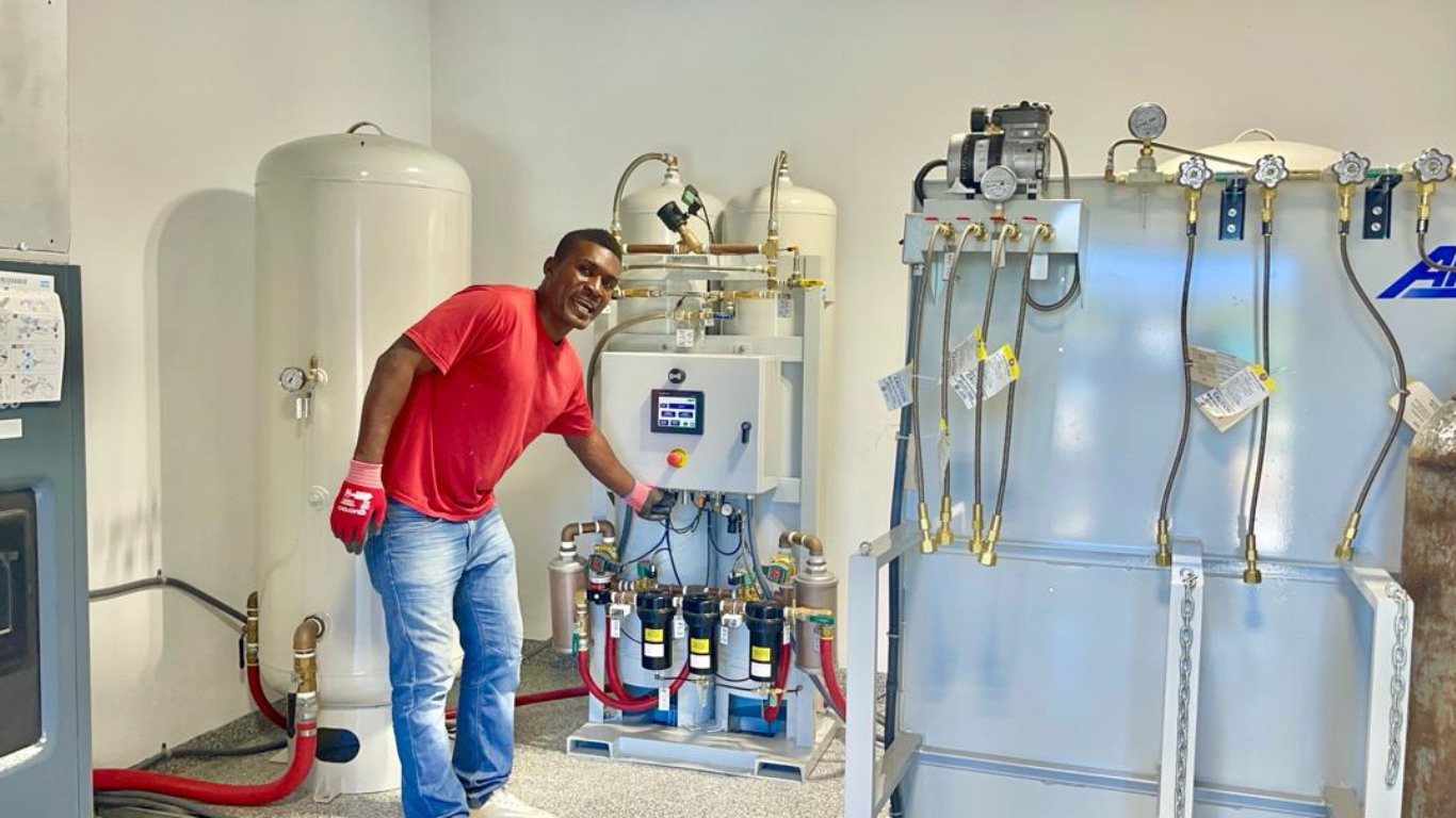 Oxygen plant equipment with man smiling