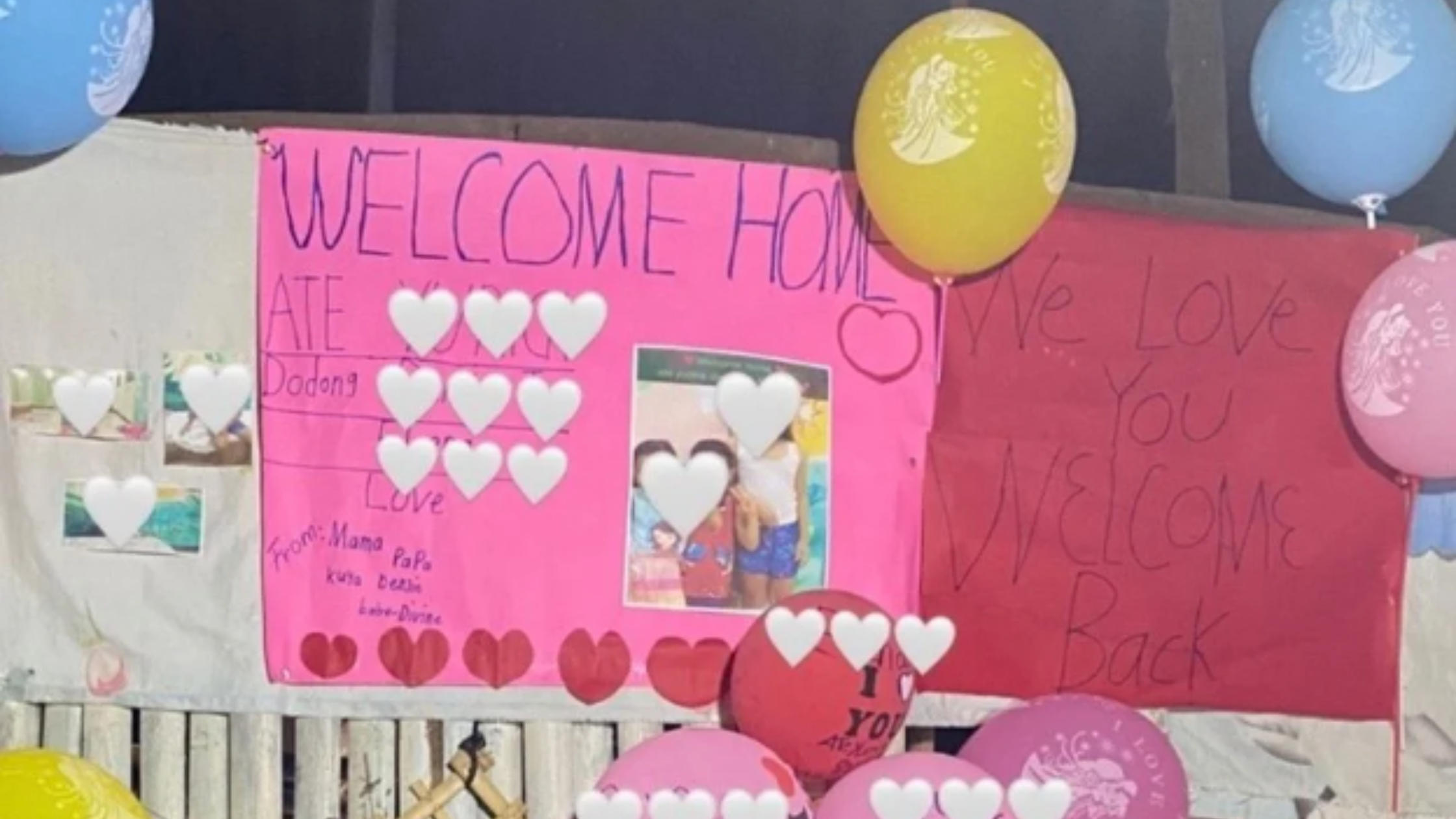 Welcome home signs and balloons for the survivors