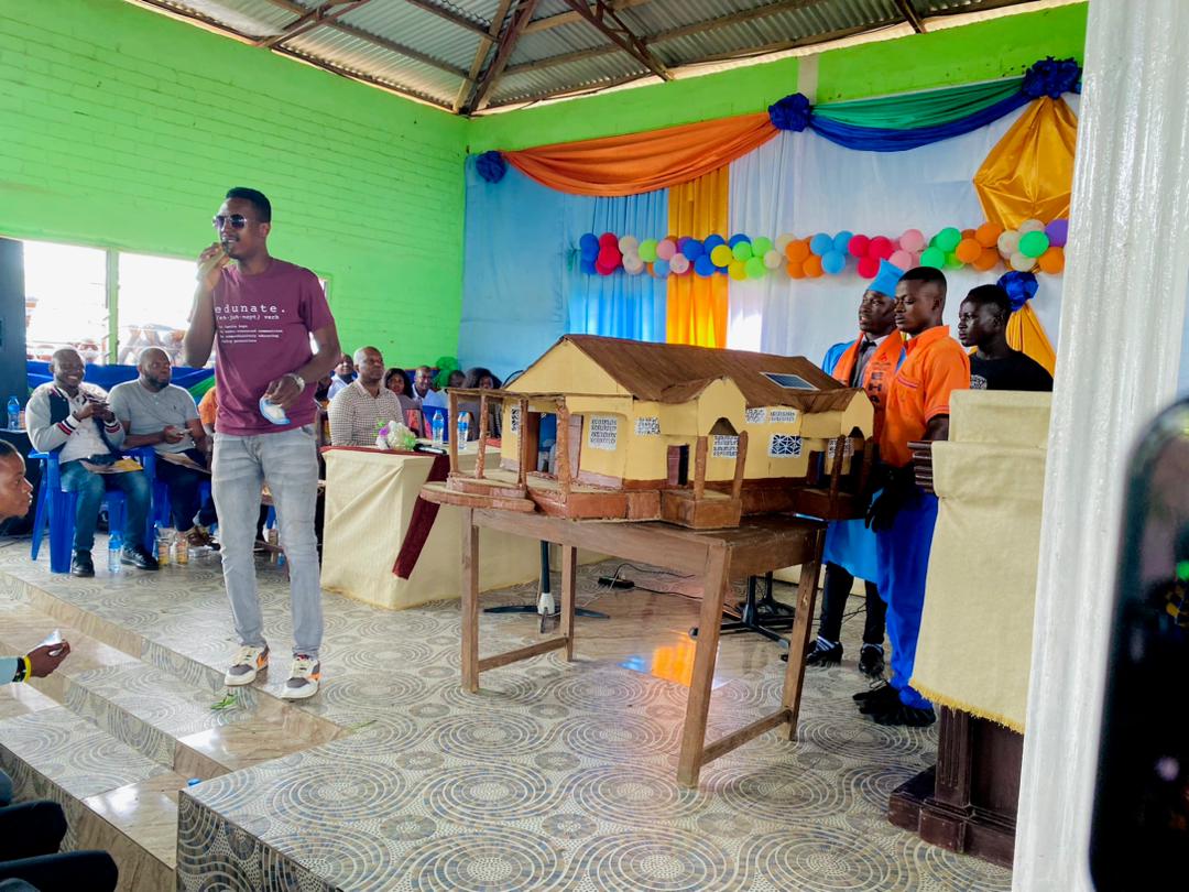 1000716579 Tino giving presentation at school graduation