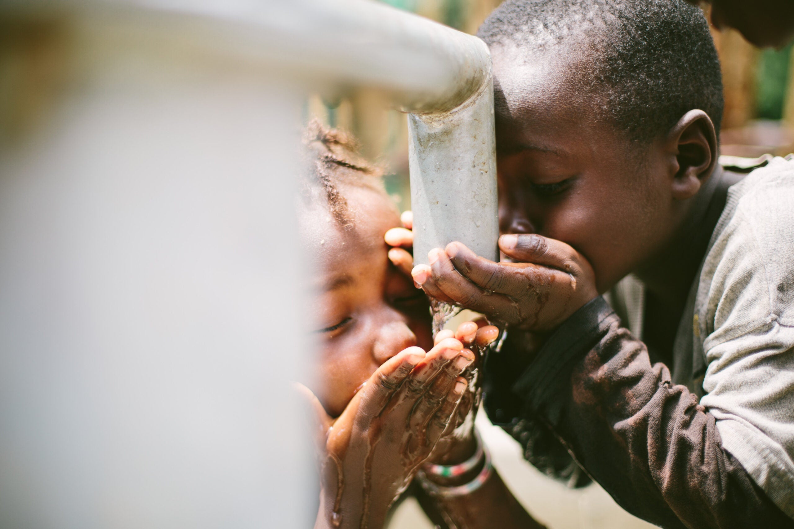 View More: http://hayleyellenday.pass.us/world-hope-international Children drinking from well in Sierra Leone