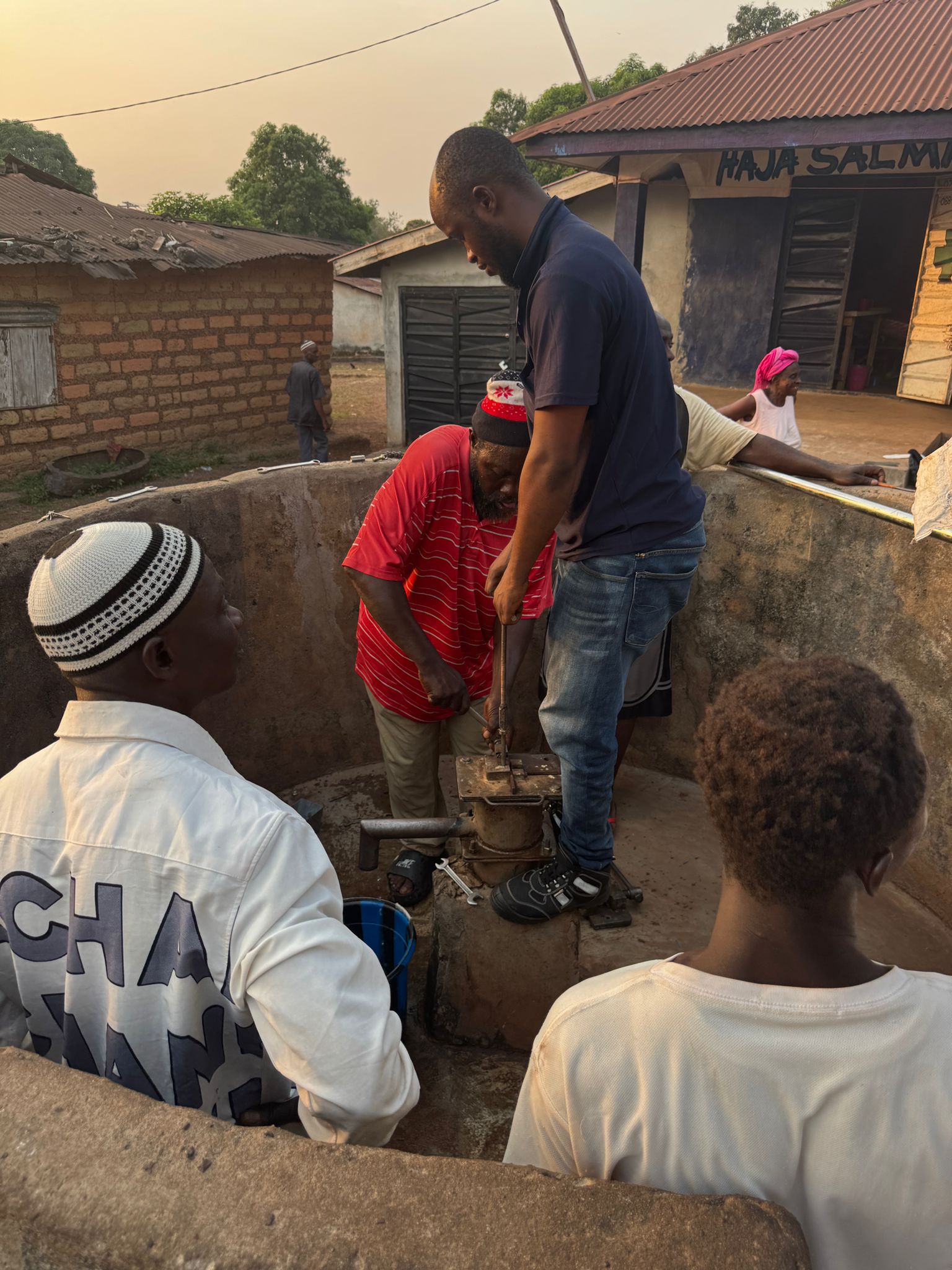 men replacing pump parts