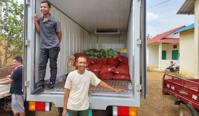 Men standing on the truck