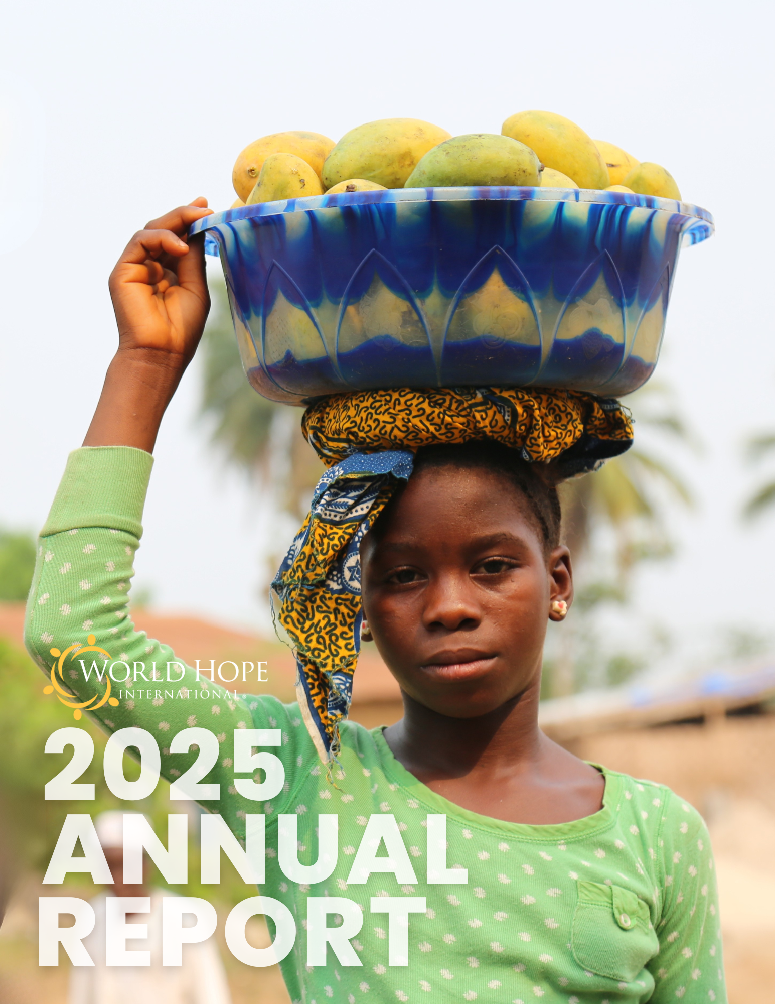 Girl from Sierra Leone with a bowl of mangoes on her head