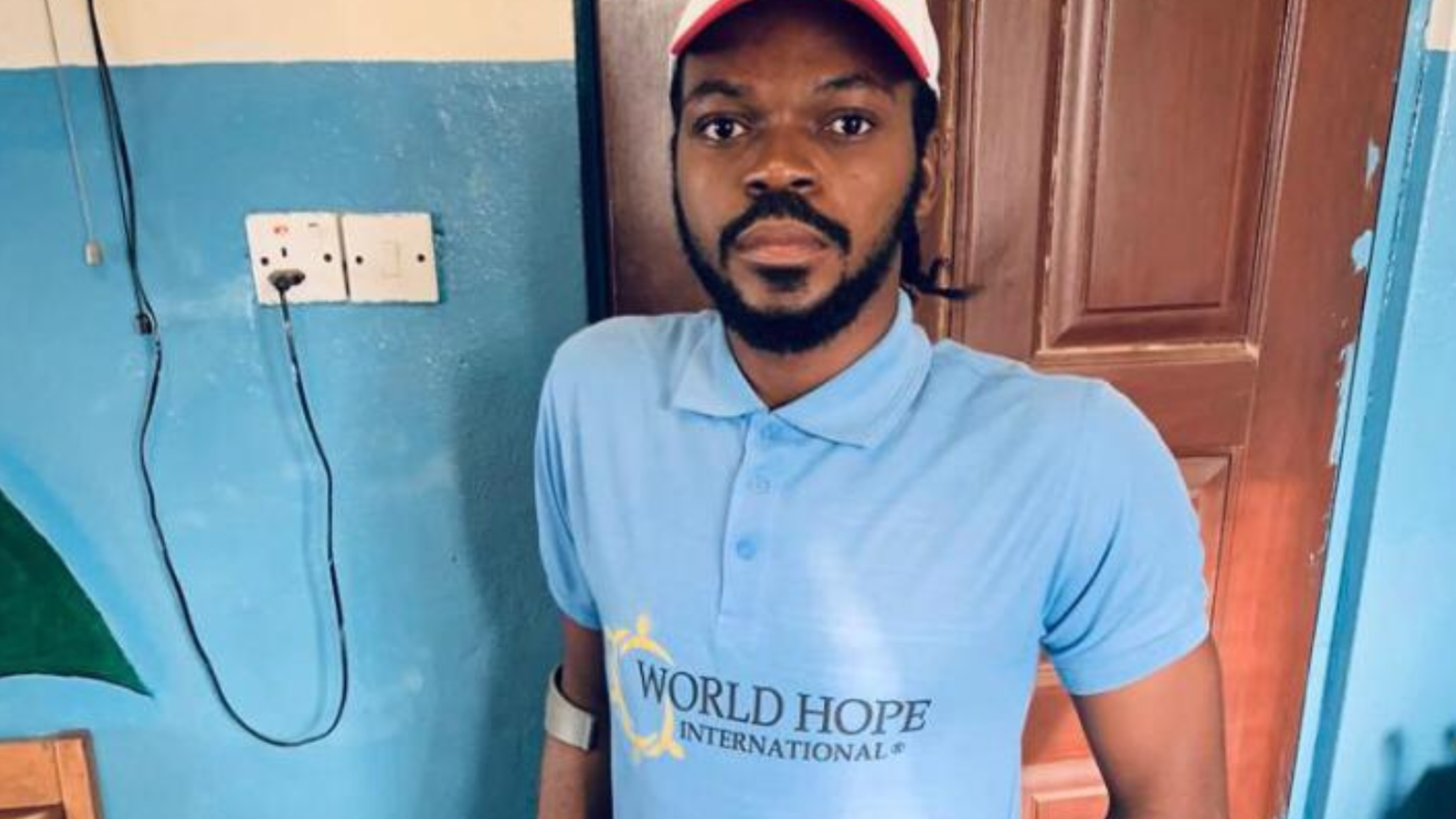 a man stands with crutches